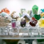 a display case filled with lots of different colored rocks