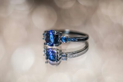 A close up of a ring with a blue stone