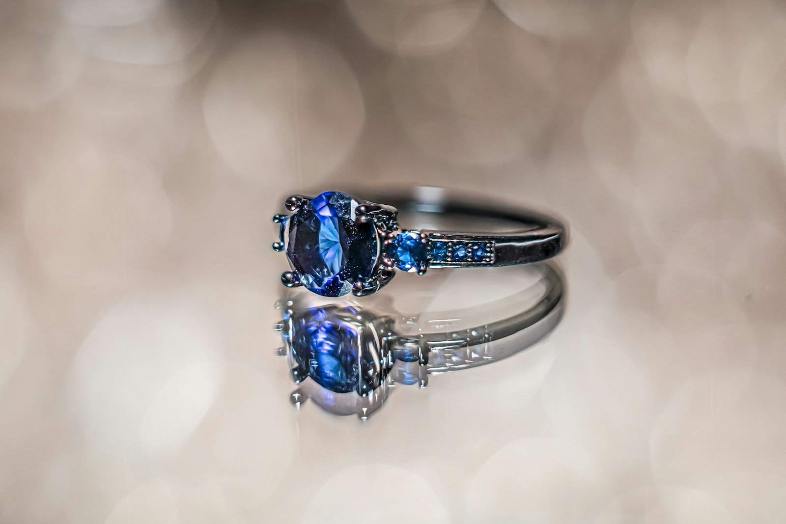 A close up of a ring with a blue stone