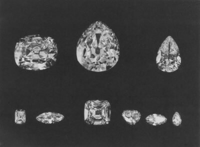 Collection of sparkling diamonds on a dark background