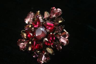 A cluster of sparkling red and pink rhinestones